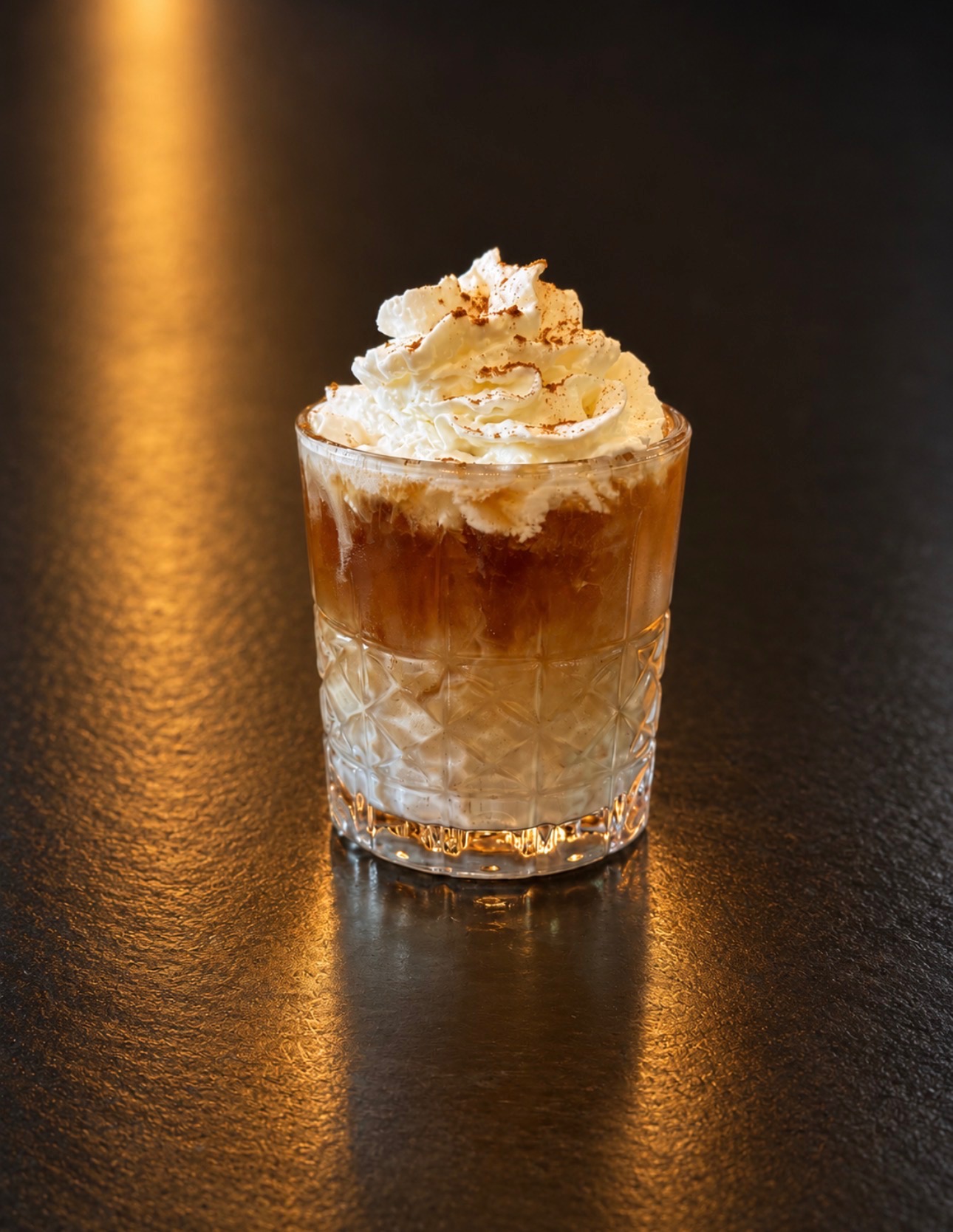 White Girl Russian cocktail topped with whipped cream and caramel at Oak and Iron