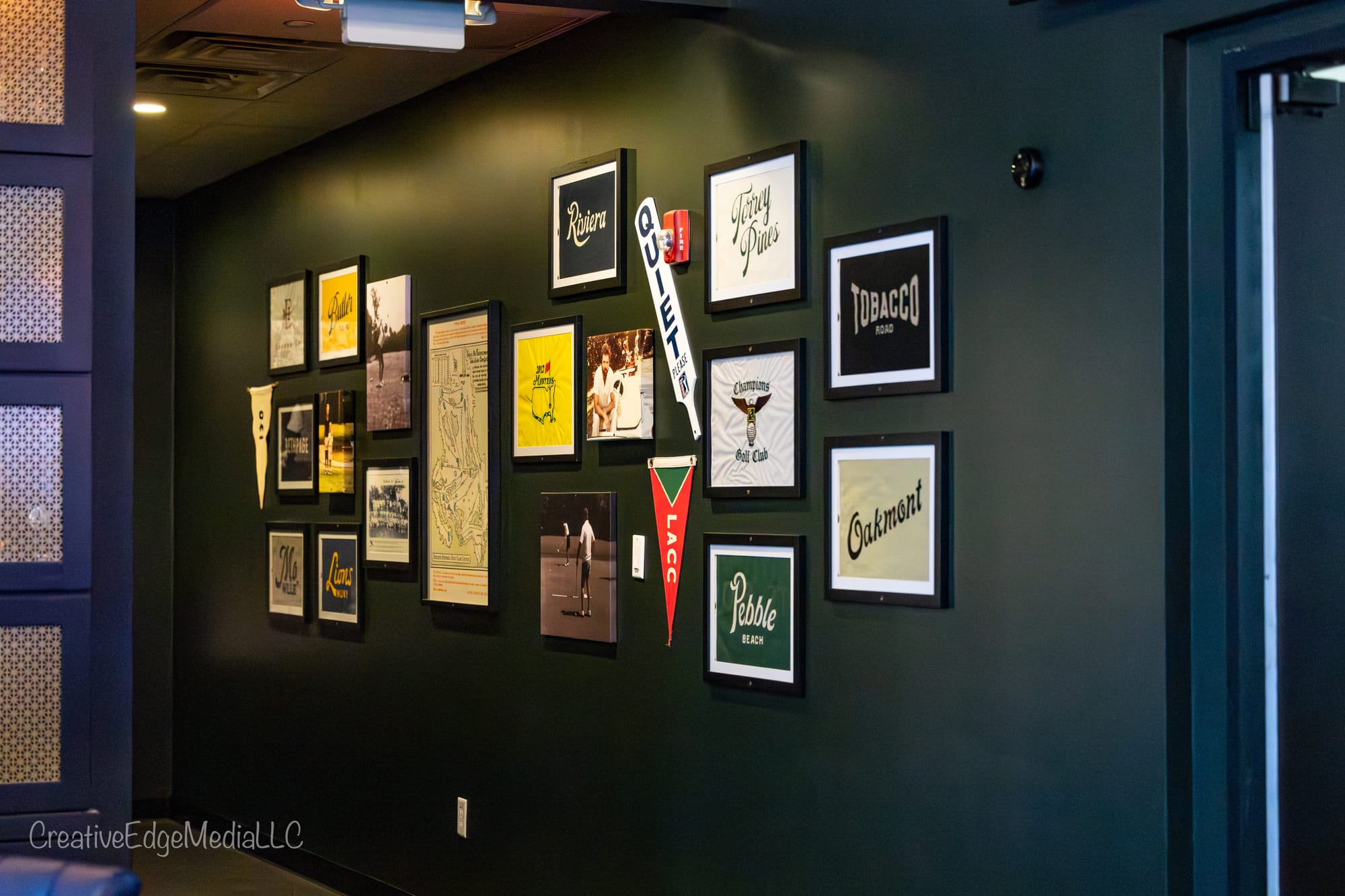 Golf memorabilia gallery wall at Oak and Iron Sports Social