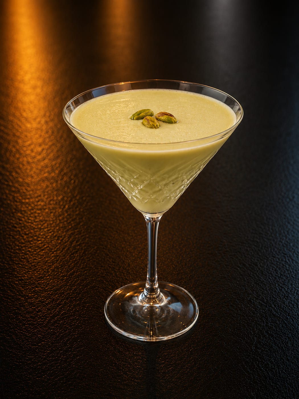 Pistachio Martini in a cut-crystal glass at Oak and Iron