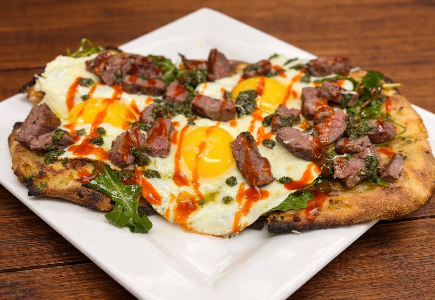 Steak and egg breakfast flatbread served at Oak and Iron